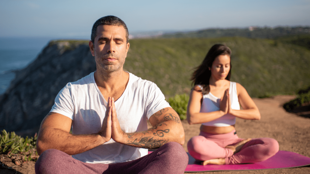 Couple meditation outdoor 