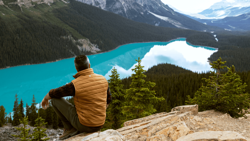 Man sitting near lake 